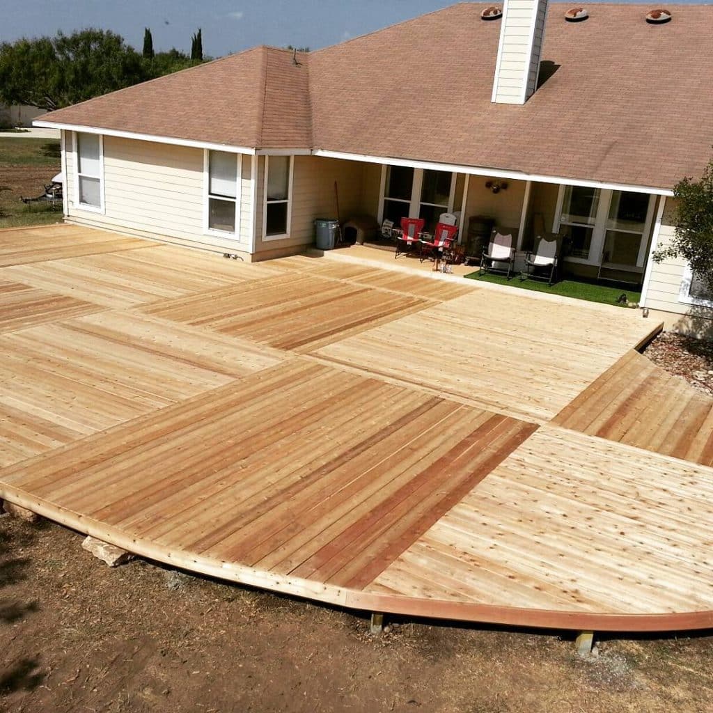 Home's back outdoor flooring being worked on