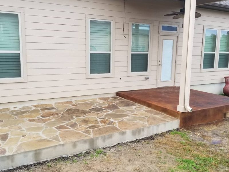 Flagstone patio extension and stained concrete porch. @real.cedar deck and arbor coming to the r